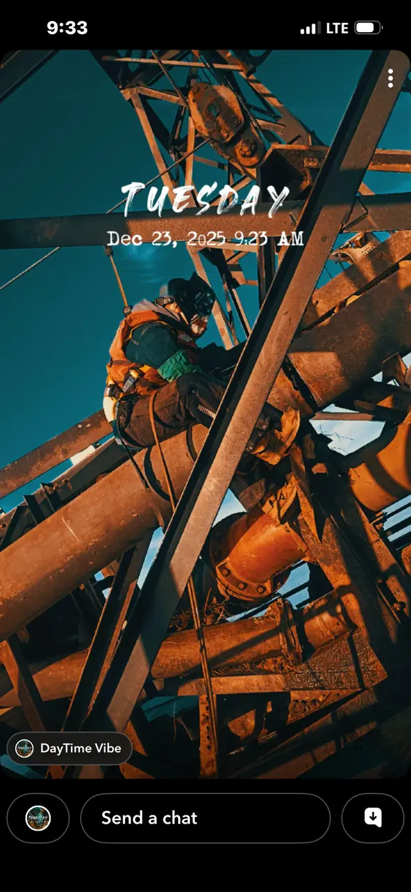 Welder working high up on industrial steel tower structure