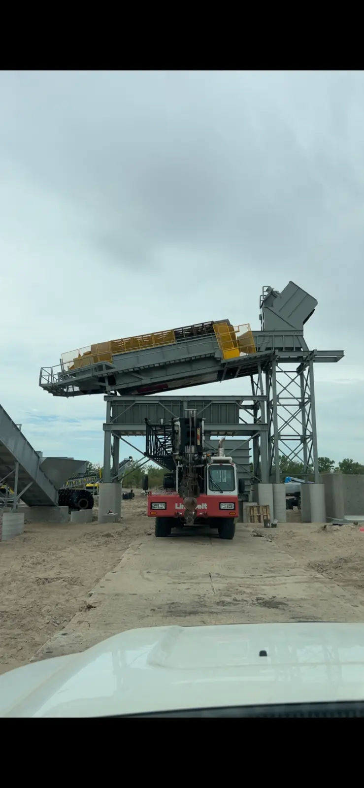 Industrial concrete plant with crane and conveyor equipment